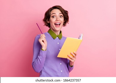 Photo of funny lady hold diary think over homework essay wear purple jumper isolated pink color background