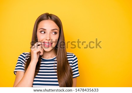 Photo of funny lady think over secret plan wear striped t-shirt isolated yellow background