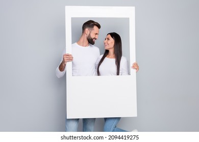 Photo of funny millennial couple take picture wear shirt jeans isolated on grey background