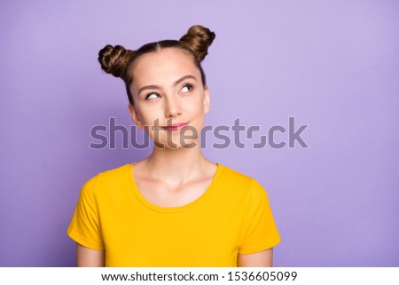 Photo of funny pretty lady youngster looking up empty space having crazy but smart idea wear yellow t-shirt isolated on pastel purple background