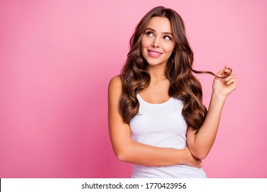 Photo of funny pretty wavy lady arm winding curl around finger wondered look up empty space dreamer wear white casual tank-top isolated bright pink color background - Powered by Shutterstock