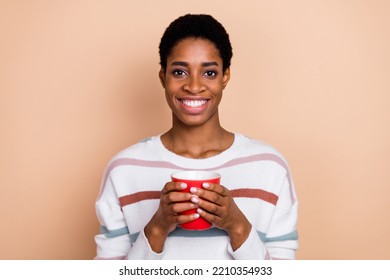 Photo Of Funny Shiny Unisex Person Wear Sweater Enjoying Hot Tasty Coffee Isolated Beige Color Background