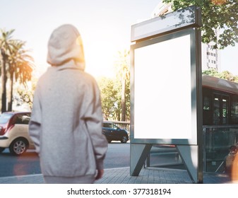 Photo Of Girl Looking At Blank Lightbox On The Bus Stop. Horizontal