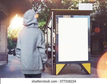 Photo Of Girl Looking At Empty Lightbox On The Bus Stop. Horizontal