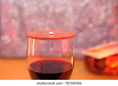 Photo Of A Glass Of Wine With A Pill,as A Concept Of The Sinclair Method: Simply Taking An Opioid Antagonist Before Drinking,which Help To Reduce Alcohol Intake.