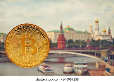 Photo Golden Bitcoins (new virtual money. Coins bitcoin in the background of Moscow. Conceptual photo.
