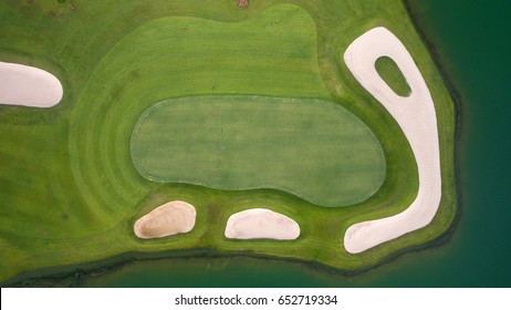 Photo of a Golf Green Flag and Hole from top by drone