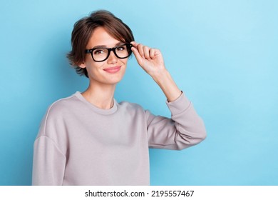 Photo Of Good Looking Lady Arm Touch Nice Eye Accessory Recommend Advice Good Choice Choose Empty Space Isolated On Blue Color Background