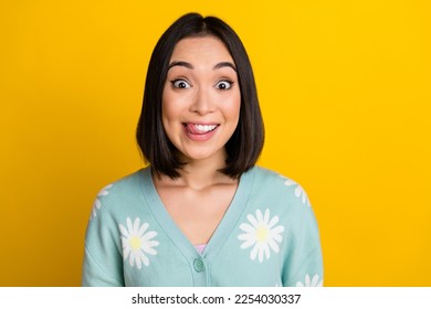 Photo of good mood astonished nice woman with bob hairdo dressed blue pullover staring lick teeth isolated on yellow color background - Shutterstock ID 2254030337