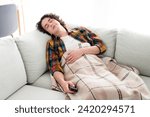 Photo of good mood cheerful guy wear plaid shirt watching tv sleeping couch indoors room home house