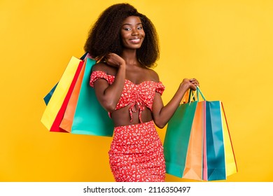 Photo of good mood young stunning girl shopaholic buy purchase black friday discount isolated on yellow color background