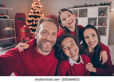 Photo Of Good Relationship Family Hug Do Selfie Wear Red Sweaters X-mas Holiday Tree Indoors House