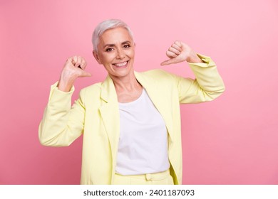 Photo of gorgeous satisfied businesswoman wear yellow suit pointing thumbs herself toothy smiling boss isolated over pink color background