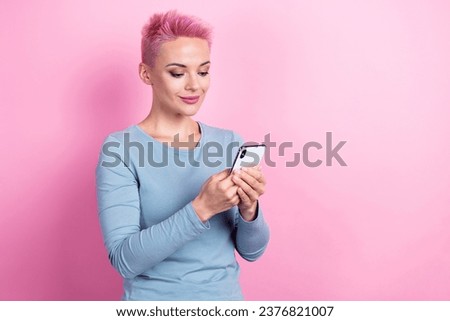 Photo of gorgeous stunning lady wear trendy clothes hold modern device texting email letter empty space isolated on pink color background