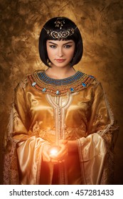 Photo Of Gorgeous Woman With Cleopatra Makeup Holding Magic Lighting Ball