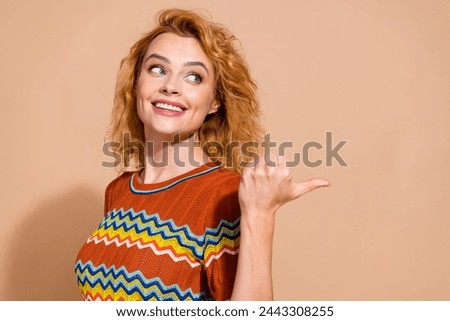 Photo of gorgeous woman with foxy hair dressed ornament t-shirt look directing at offer empty space isolated on pastel color background