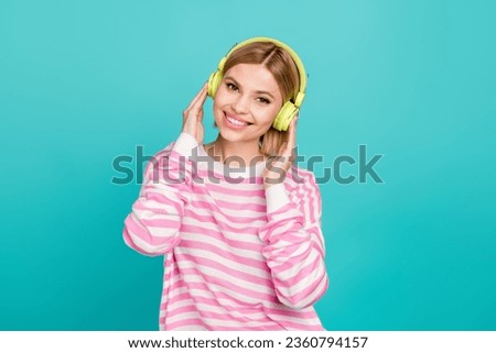 Photo of gorgeous youth girl hipster enjoy spotify phonk playlist album download new update for earphones isolated on cyan color background