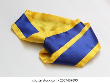 Photo Of A Graduation Sash Fabric With A Blue And Yellow Pattern Made Of Synthetic Material