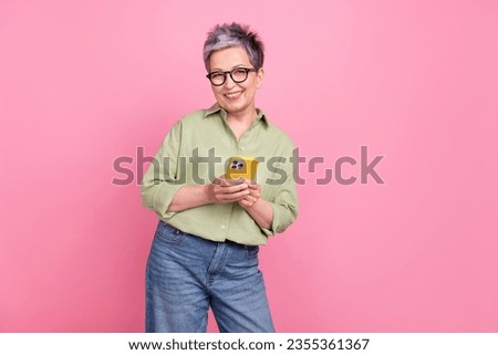 Photo of grandmother optimistic person writing chatting smartphone gadget user apple iphone technology isolated on pink color background