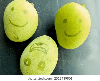 photo of a green and fresh mango with a face drawn with a wide smiling expression  - Powered by Shutterstock