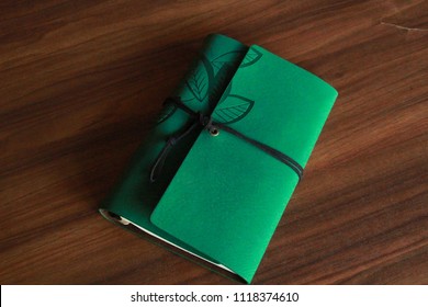 Photo Of Green Leather Sketch Book.