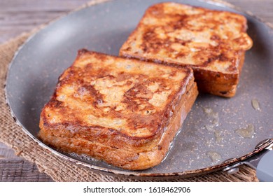 Photo Of A Grilled Cheese Sandwich Cooking In A Large Frying Pan.