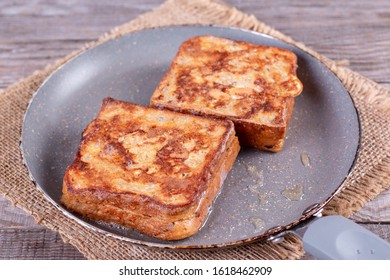 Photo Of A Grilled Cheese Sandwich Cooking In A Large Frying Pan.