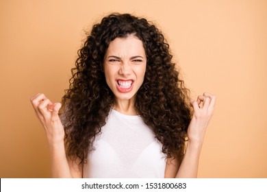 Photo of grimacing mad girl going insane with being bothered by stupid people around her isolated over beige pastel color background