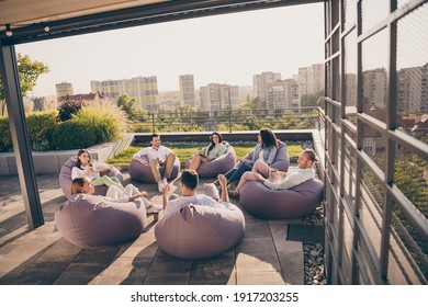 Photo Of Group Agents Sitting Beanbag Thinking Startup Marketing Strategy Outdoors Outside Workshop Workstation