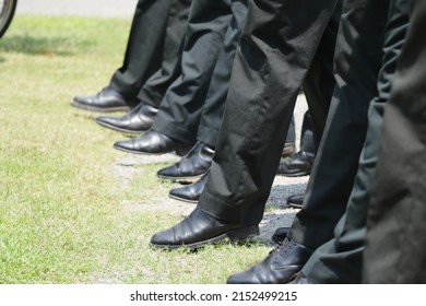 Photo Of A Group Of Businessmen Walking On An Urban Street