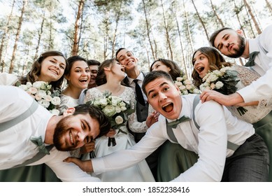 photo of a group of friends,european happy couple celebrate their marriage with friends,Beautiful wedding couple with bridesmaids and grooms,happy racial friends laughing and having time - Powered by Shutterstock