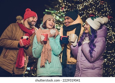 Photo of group positive cheerful people enjoy hot chocolate speak communicate noel miracle outdoors - Powered by Shutterstock