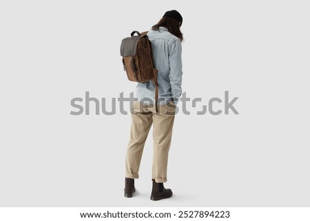 Photo of a guy with a backpack, view from the back