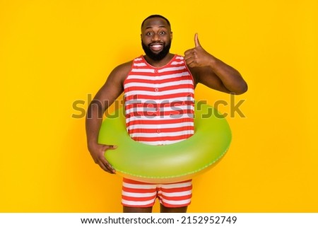 Similar – Image, Stock Photo Black man in swimsuit sitting on sandy beach