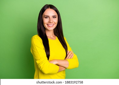 Photo Of Half Turned Person Crossed Hands Toothy Smile Look Camera Isolated On Green Color Background