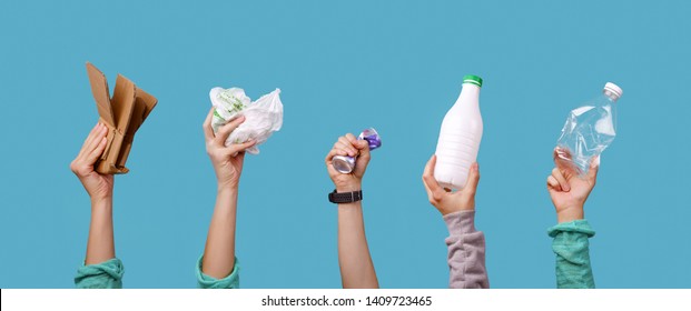 Photo of hands holding bottles, package for recycling - Shutterstock ID 1409723465