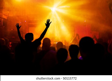 Photo Of Hands At Rock Concert, Silhouettes Against Stage Lighting