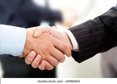 Photo Of Handshake Of Business Partners After Striking Deal