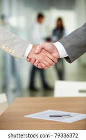 Photo Of Handshake Of Business Partners After Signing Contract