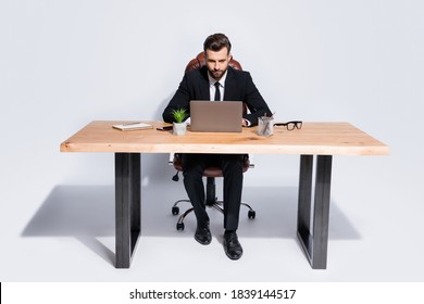 Photo Of Handsome Business Guy Notebook Table Chatting Colleagues Partners Seriously Read Corporate Report Wear Black Blazer Shirt Pants Shoes Suit Sitting Chair Isolated Grey Background