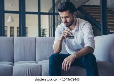 Photo Of Handsome Business Guy Sitting Big Comfy Couch Holding Alcohol Beverage Hand In Modern Trendy Interior Office Indoors Wear Formalwear White Shirt Pants