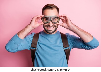 Photo Of Handsome Cute Young Guy Wear Blue Pullover Arms Glasses Backpack Ready To Skydive Isolated Pink Color Background