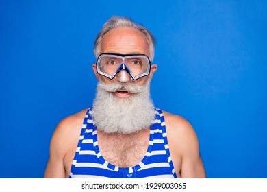 Photo Of Handsome Happy Positive Smiling Old Man In Goggles Wear Swimming Suit Isolated On Blue Color Background