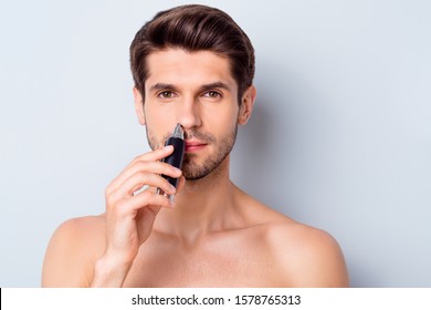 Photo Of Handsome Macho Man Guy Looking Mirror Using Electric Battery Trimmer Get Rid Of Nose Hair Topless Tender Torso Metrosexual Body Isolated Grey Background