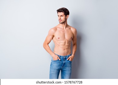 Photo Of Handsome Macho Man Guy Topless Sporty Torso Metrosexual Hot Tender Body Holding Hands In Pockets Looking Side Attentively Wear Jeans Isolated Grey Background