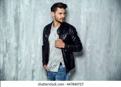 Photo of handsome man in black leather jacket