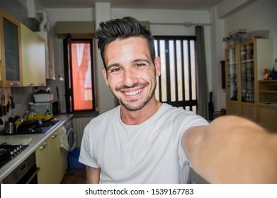 Photo Of Handsome Man Taking A Selfie At Home Smiling On The Camera