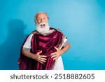 Photo of handsome senior male laughing comedy have fun wear ancient greek god king dress isolated on blue color background