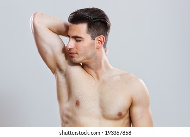 Photo Of Handsome Young Man Smelling His Armpit After Shower,Freshness After Shower