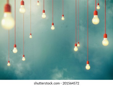 Photo of Hanging light bulbs with depth of field. Modern art